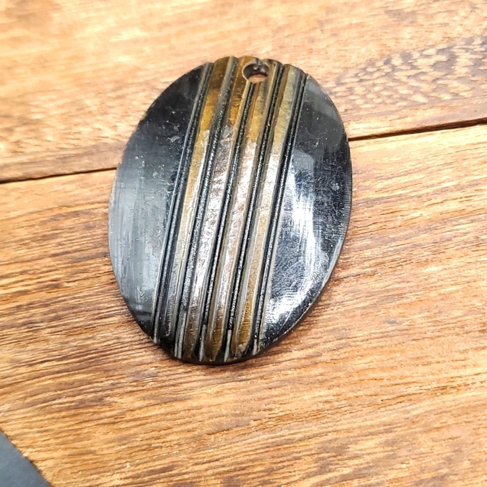 Zanzabar cabochon brutalist beetle back pendant